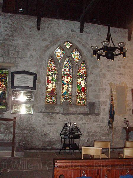 26-OuterWall.jpg - Stain glass window in one of the chapels.